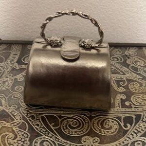 Rodo Metallic gold Clutch